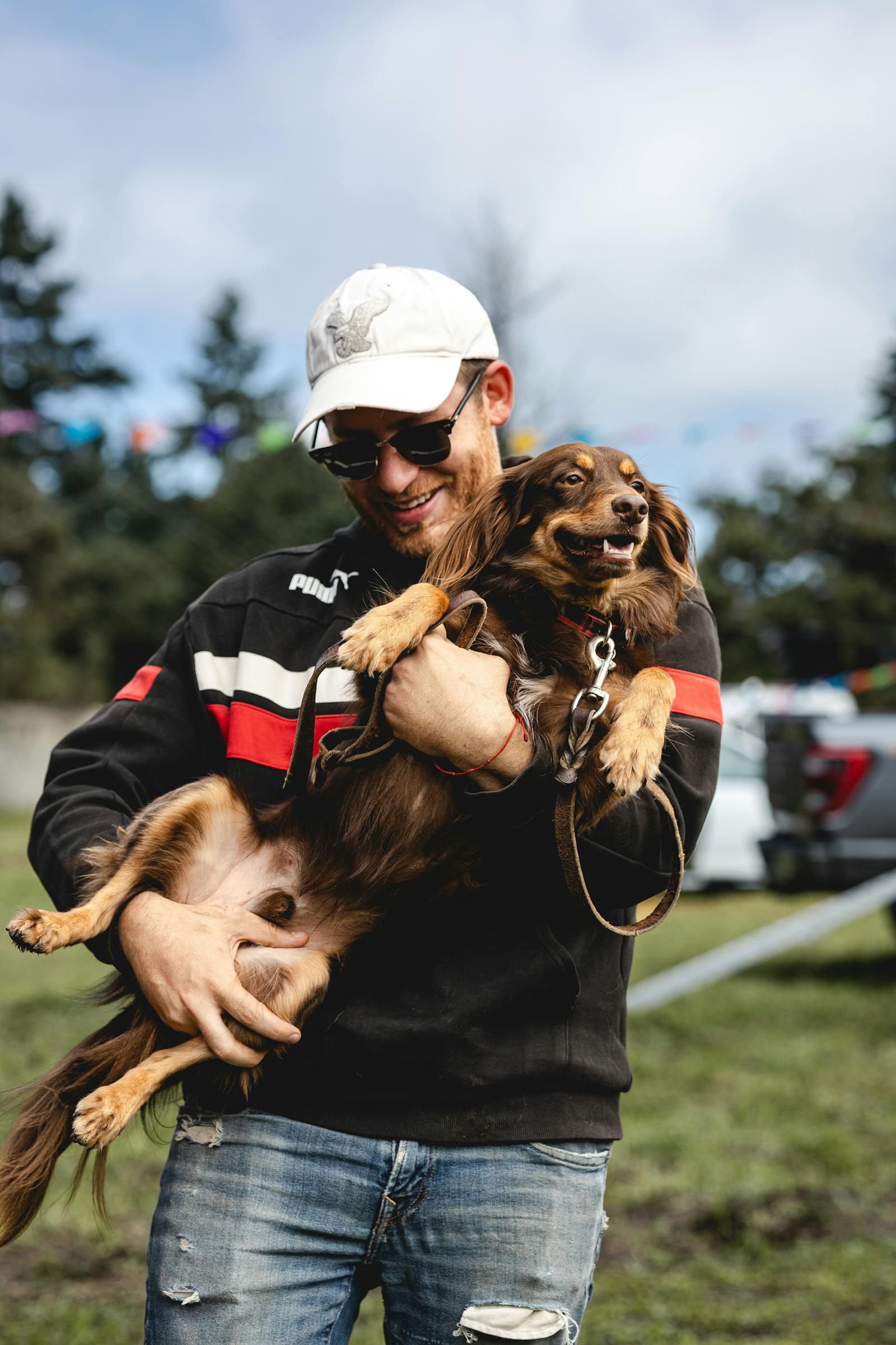 Smiling man outdoors with his dog